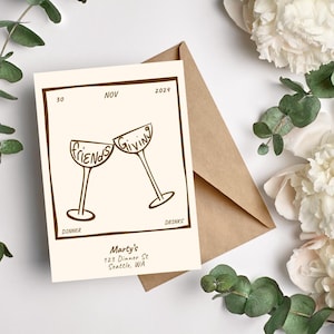 May include: A cream-colored card with brown text and a brown border. The card has a drawing of two wine glasses clinking together. The text on the glasses reads "Friends" and "Giving". The card also has the text "Marty's 123 Dinner St Seattle, WA".