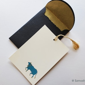 Unwritten 4 - handcrafted stationery set, black A7 gold liner envelopes, bookmark style notes, blue Nandi cow print, gold tassels - Set of 6