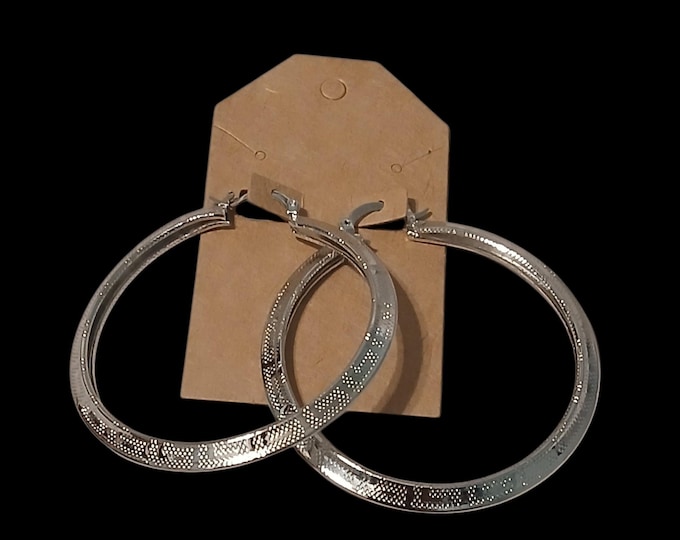 Printed textured silver plated hoops.