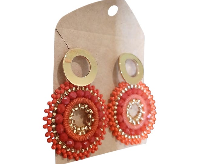 Coral earrings, gold and red.