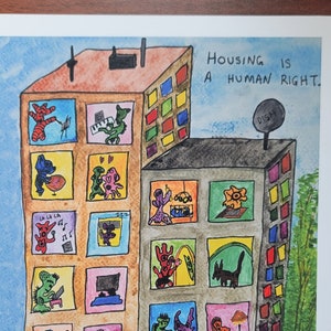 Le logement est un droit humain : impression par @MonstrousWatercolors sur du papier cartonné 8,5 x 11