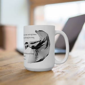 May include: White ceramic coffee mug with a black and white illustration of a person in mid-air, with the text "The artist never entirely knows. Guess like he may be wrong. You take leap after leap in the dark."