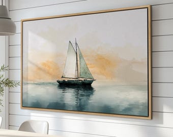 May include: A watercolor painting of a sailboat on a calm sea with a soft, orange sunset in the background. The sailboat has white sails and a dark blue hull. The painting is framed in a light wood frame.