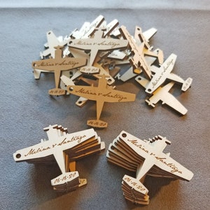 100 little wood engraved airplanes.