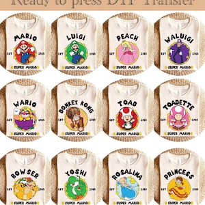 May include: A collection of cream-colored t-shirts featuring various Super Mario characters. Each shirt displays a character's name, a graphic, and the text "Super Mario" and "1985". The text "Ready to press DTF Transfer" is at the top.