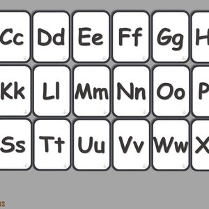 May include: A set of alphabet flash cards with black letters on white cards. The letters are in uppercase and are written in a playful, rounded font. The cards are arranged in a grid pattern.