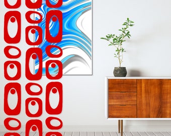 May include: A white wall with a red and white abstract design on the left side. A framed abstract painting with blue and white swirls hangs on the wall. A wooden cabinet with two drawers and a door sits in front of a potted plant.