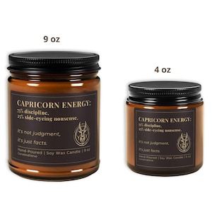 Side-by-side view of 9 oz and 4 oz Capricorn Energy Candles, highlighting the size difference and the detailed zodiac-themed label.