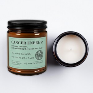 Cancer Zodiac Candle in 9 oz size with light green label. Open jar showing hand-poured soy wax, highlighting clean burn and minimalist design.