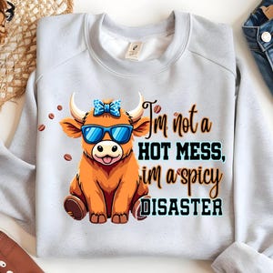 I&#39;m Not A Hot Mess I&#39;m A Spicy Disaster Highland Cow SVG PNG, Funny Western Sublimation Design, Cheeky Cow with Leopard Bow for T-Shirt Gift