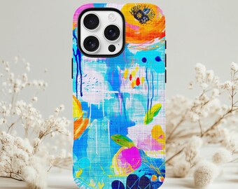 May include: A colorful phone case featuring an abstract floral design. The case has a white background with blue, orange, pink, and yellow brushstrokes. The design includes floral shapes and paint drips, creating a vibrant and artistic look.