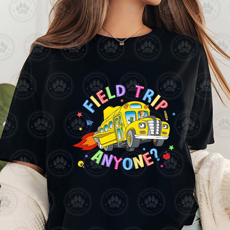 May include: Black t-shirt featuring a yellow school bus graphic and the text "Field Trip Anyone?" in rainbow colours.