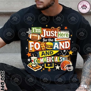May include: Black t-shirt featuring a vibrant graphic with a football, pizza, burger, and the words "I'm Just Here for the Food and Commercials". A fun design for sports fans.