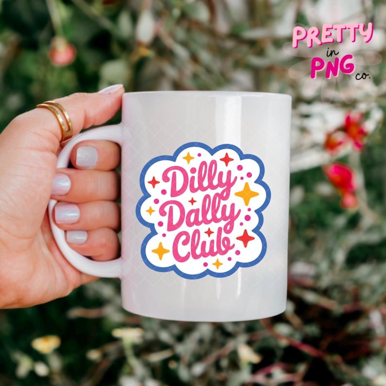May include: A white ceramic mug featuring a blue scalloped border graphic with the pink text Dilly Dally Club. The design is accented with small yellow and red star shapes scattered around the lettering on the front of the mug.