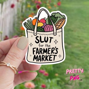 May include: A white tote bag with a colourful illustration of produce and the text "Slut for the Farmer's Market".