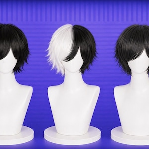 May include: Three wigs displayed on white mannequin heads. The wigs are black, black and white, and black. The wigs have a short, layered style. The mannequins are on white circular bases against a blue background.