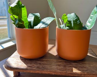 Orange Sunburst Ceramic Planter: Unique Pattern Pottery