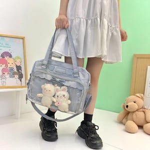 Japanische nette transparente Segeltuch Itabag Mode-Mädchen eine Schulter-Student Personality Crossbody Bag mit Badge Doll Ita Bag