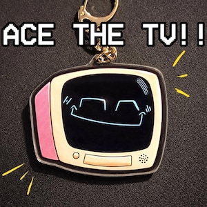 ACE THE TV - 2,5-calowy dwustronny brelok akrylowy