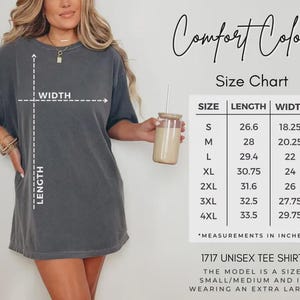May include: A gray unisex tee shirt with a size chart. The chart shows measurements in inches for sizes S to 4XL. The shirt is labeled "1717 Unisex Tee Shirt". The model is wearing an extra large.