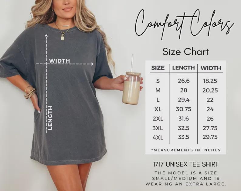 May include: A gray unisex tee shirt with a size chart. The chart shows measurements in inches for sizes S to 4XL. The shirt is labeled "1717 Unisex Tee Shirt". The model is wearing an extra large.
