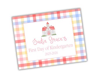 May include: A rectangular card with a gingham pattern in red, yellow, blue, and orange. The card features a white center with a schoolhouse illustration and the text "Sadie Grace's First Day of Kindergarten 2025-2026."