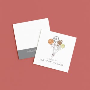May include: White square card with a gray border and the text "@NatalieART". Another card features a watercolor illustration of sports balls as balloons, with the text "a gift from HATTON MARION". The background is a solid red color.