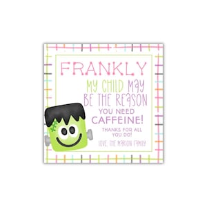 May include: Square card with a green border and a colorful plaid pattern. The card features a cartoon Frankenstein's monster and text that reads "FRANKLY MY CHILD MAY BE THE REASON YOU NEED CAFFEINE!" and "LOVE, THE MARION FAMILY."