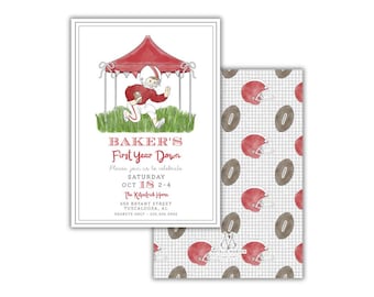 May include: A set of football-themed invitations. The main invitation features a red tent with a football player illustration and text that reads "Baker's First Year Down." The patterned backing has red helmets and brown footballs.