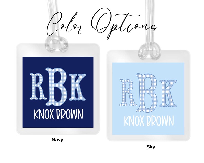 May include: Two square luggage tags with clear plastic loops. The left tag is navy blue with the white text RBK and KNOX BROWN. The right tag is sky blue with the same text. Both feature a blue and white gingham pattern on the letters RBK.