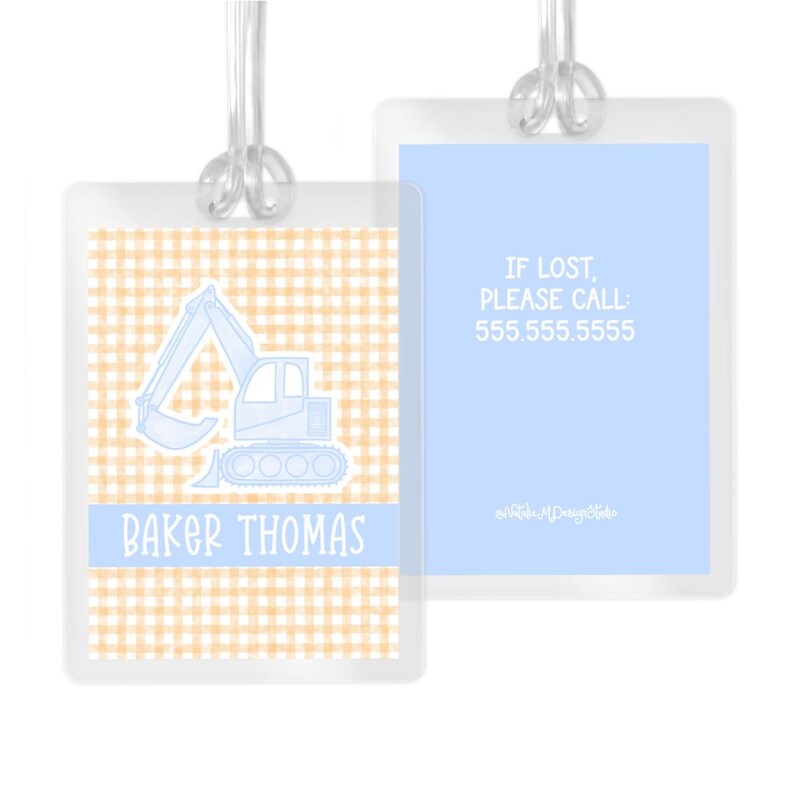 May include: Blue and orange gingham luggage tag with a blue outline of an excavator and the text "Baker Thomas". The back of the tag has a light blue background with the text "If lost, please call 555.555.5555".