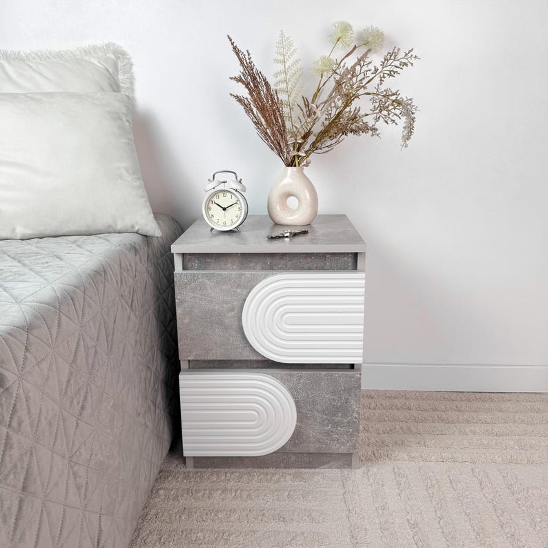 May include: A set of three ceramic mugs with a speckled, matte finish. The mugs are in shades of cream, light gray, and dark gray. Each mug has a simple, minimalist design, perfect for coffee or tea.