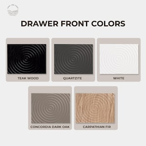 May include: An image showcasing five drawer front color options: Teak Wood, Quartzite, White, Concordia Dark Oak, and Carpathian Fir. Each sample features a circular textured design. The text "DRAWER FRONT COLORS" is displayed above the samples.