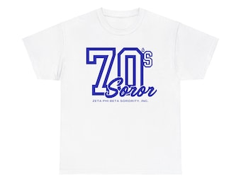 May include: White t-shirt with a blue graphic of "70's Soror" with the text "Zeta Phi Beta Sorority, Inc."