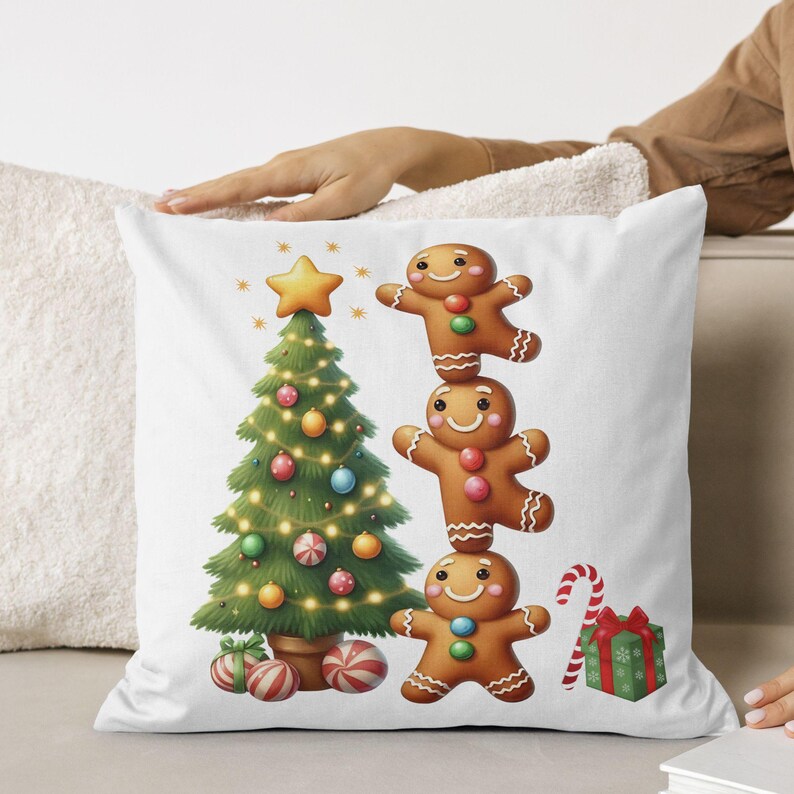 May include: White square pillow featuring a Christmas tree with ornaments, a star on top, and string lights. Three gingerbread men are stacked on top of each other. A candy cane and a wrapped gift are also present.