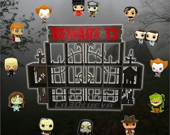 May include: A black wooden shelf with a "Beware 13" sign and a black metal gate design. The shelf has 12 compartments for displaying small figurines. The shelf is surrounded by various horror-themed figurines, including characters from the movies "It", "The Exorcist", "The Creature from the Black Lagoon", and "The Nun".
