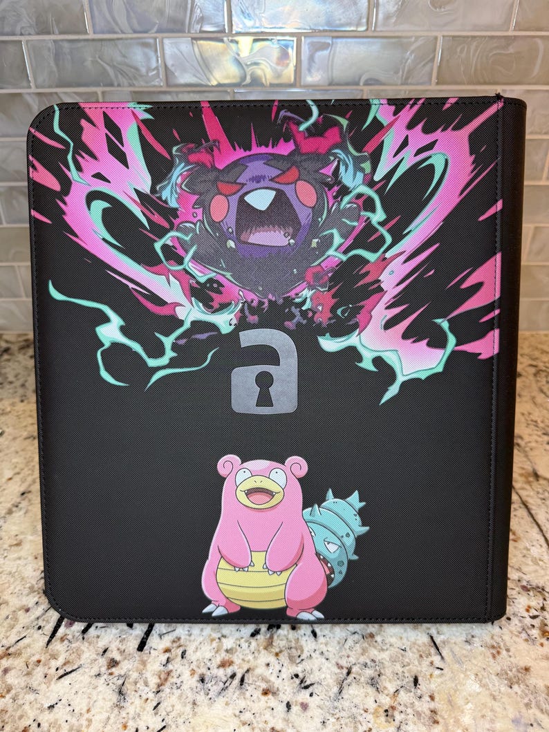 May include: A black rectangular binder featuring a graphic of a dark purple creature with red eyes surrounded by pink and teal energy, a grey padlock icon in the center, and a pink Slowpoke character with a blue shell on its tail at the bottom.
