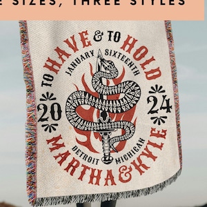 May include: A woven tapestry with a red and black snake design. The text "To Have & To Hold" is written in a circle around the snake. The text "January Sixteenth 2020" and "24" are also written in a circle around the snake. The text "Detroit Michigan Martha & Kyle" is written below the snake.