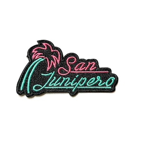 May include: Black embroidered patch with pink and green text that reads "San Junipero". A pink palm tree is on the left side of the patch.