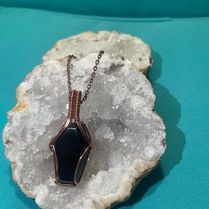 Obsidian Coffin Wrapped in Copper