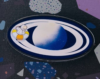 Saturn: classic space age design astronaut manatee acrylic pin