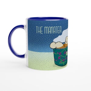 The manatea is excellent today Ceramic Mug with blue handle and inside 11oz with an illustration of a manatee in teacup infused in shade