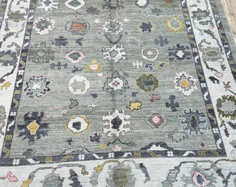 14675 – Handmade Oushak Rug 8x10 ft, Green Wool Area Rug with Cream Border and Colorful Floral Motifs, Turkish Carpet for Living Room