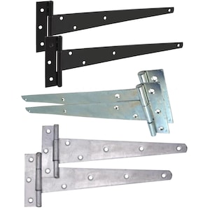 May include: A collection of six T-hinges arranged in three pairs. Two hinges are matte black, two are silver-toned galvanised metal, and two are a textured grey metal. Each hinge features a rectangular mounting plate and a long tapered strap.