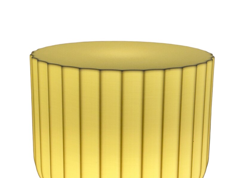 Close-up of the top portion of a modern table lamp, highlighting the Japanese rice paper-inspired ridges that beautifully diffuse light. The design creates a soft, warm glow against a white background.