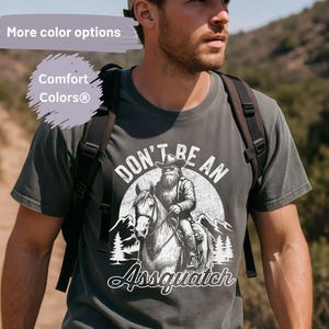 Don’t Be an Assquatch T-Shirt, Funny Bigfoot Riding Horse Tee, Western Sasquatch Shirt, Comfort Colors® Cowboy Humor Graphic Tee