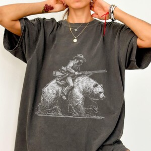 Comfort Colors® Cowboy Riding Bear T-Shirt - Wild West Graphic Tee for Outdoor Enthusiasts, Adventure Lovers, Quirky Western Style