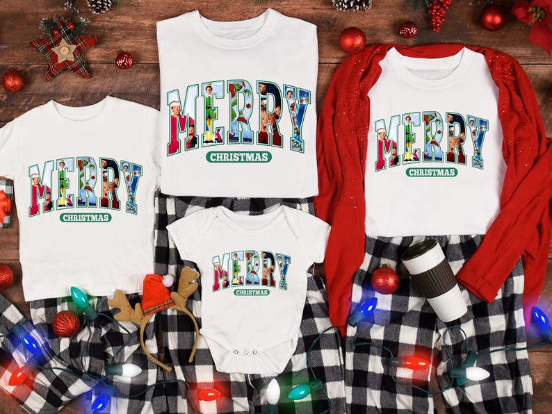 May include: A set of four white t-shirts with the words "Merry Christmas" printed on them. The word "Merry" is made up of images of Christmas characters. The shirts are arranged on a black and white checkered fabric with Christmas lights and ornaments.