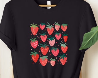 May include: Black t-shirt with a graphic print of red, pink, and green strawberries with white hearts.