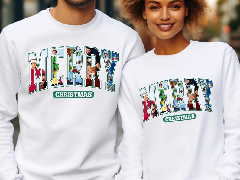 May include: White Christmas themed sweatshirts with the word "Merry" spelled out in large letters. Each letter is made up of a different Christmas movie character. The text "Christmas" appears below the word "Merry".
